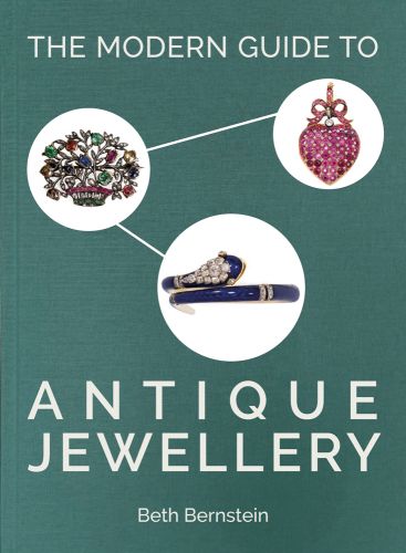 Sage green cover with three white circles adjoined with lines featuring three pieces of antique jewellery with The Modern Guide to Antique Jewellery Beth Bernstein in white