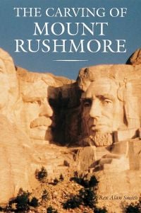 Rock sculpture of Theodore Roosevelt and Abraham Lincoln below blue sky, The Carving of Mount Rushmore in white font above.