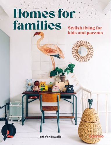White interior space, child's desk, toy telephone, flamingo wall mural, Homes for Families in dark green font to upper left.