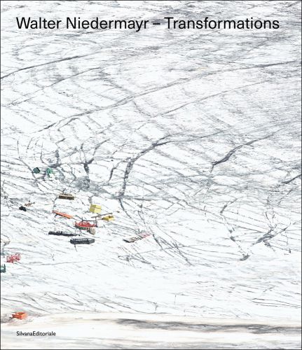 Land covered in cracked snow and ice with small boats and ships floundering on surface with Walter Niedermayr - Transformations in black font above