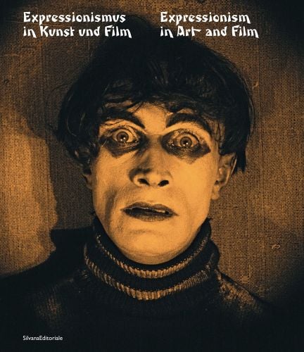 A young Conrad Veidt, as somnambulist in The Cabinet of Dr. Caligari, wide staring eyes, white face paint, Expressionism in Art and Film in white font to upper right.