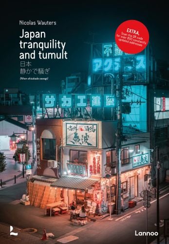 Neon lights Japanese cityscape with Japan tranquility and tumult in white font and red circle with extra in white font