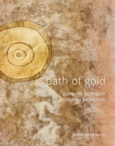 Mottled gold and beige cover with circular pattern to upper left, path of gold in white font to lower right.