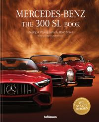 Sleek studio shot of silver-grey Mercedes Benz 300L 2 seater sports car, drivers gull wing door open, The Mercedes-Benz 300 SL Book in black font above
