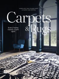 Book cover of Carpets & Rugs, Every home needs a soft spot, with an interior with navy wall panelling, large black and white rug, and arched windows. Published by Lannoo Publishers.