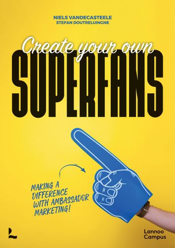 Create Your Own SUPERFANS in white, and black font on bright yellow cover, giant blue foam pointed finger below.
