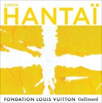 Bright yellow font above white cross shape with four yellow squares, on cover of 'Simon Hantaï' by Editions Gallimard.