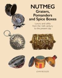 5 decorative wood and metal spice graters and boxes on cream cover, with Nutmeg: Graters, Pomanders and Spice Boxes