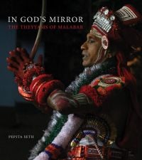 Indian man in traditional dress performing ritual, on cover of 'In God's Mirror, The Theyyams of Malabar', by Scala Arts & Heritage Publishers.