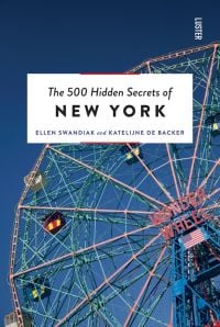 Low angled shot of Deno's Wonder Wheel Amusement park Ferris wheel, The 500 Hidden Secrets of NEW YORK in black font white banner above.