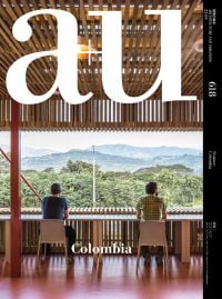 Book cover of a+u 22:03, 618: Feature: Colombia, with two people looking out to the Colombian landscape. Published by Shinkenchiku-Sha Co., Ltd.