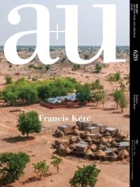 Book cover of a+u 22:05, 620: Feature: Francis Kere, with African landscape with small huts. Published by Shinkenchiku-Sha Co., Ltd.
