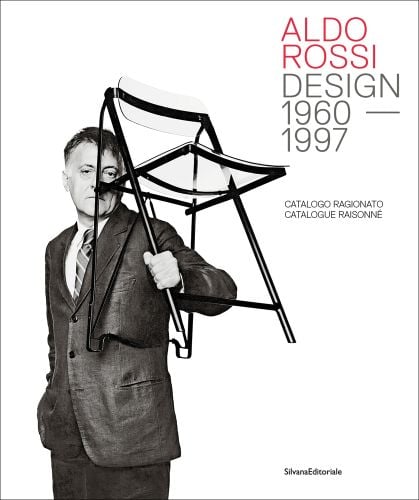 Aldo Rossi grasping black framed clear Perspex chair in left hand, on white cover, ALDO ROSSI DESIGN 1960-1997 in red and grey font to top right.