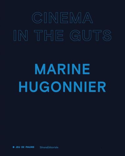CINEMA IN THE GUTS in blue stencilled font above MARINE HUGONNIER in blue font, on navy cover, by Silvana.