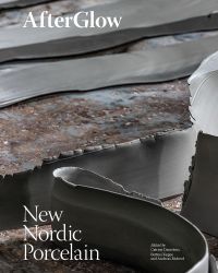 Torn grey edges of porcelain, on cover of 'AfterGlow, New Nordic Porcelain', by Arnoldsche Art Publishers.