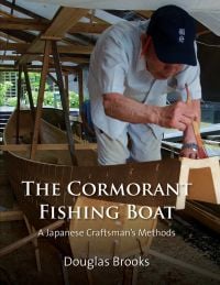 Book cover of The Cormorant Fishing Boat: A Japanese Craftsman's Methods, with a boatbuilder painting a wooden boat. Published by Floating World Editions.