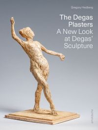 Plaster sculpture of female ballerina with one arm in air, on plinth, in exhibition space, on cover of 'The Degas Plasters', by Arnoldsche Art Publishers.