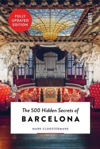Interior of concert hall stage area, Palau de la Música Catalana, The 500 Hidden Secrets of BARCELONA in black font on bottom white banner.
