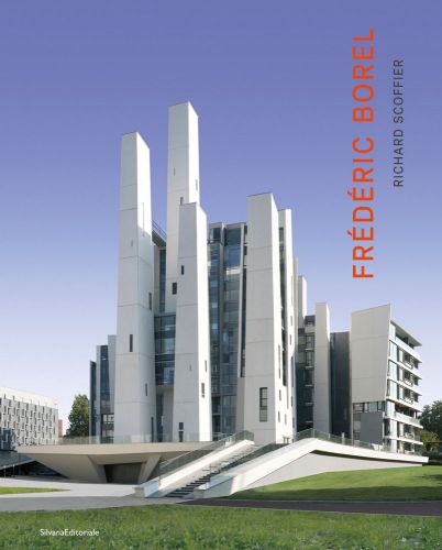 Modern high rise building under blue sky, FREDERIC BOREL in red font down right edge.