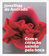 Photo of 'With the Heart Coming Out of Mouth' installation, Jonathas de Andrade Com o coração saindo pela boca, in white font, above and below.