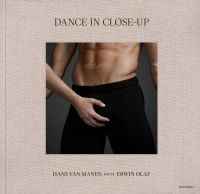 Torso of white male in black pants, white female hand on crotch area, on beige linen cover of 'Dance in Close-Up, Hans van Manen seen by Erwin Olaf', by Hannibal Books.