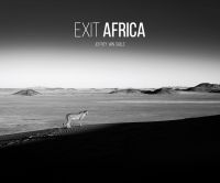 Lone cheetah standing in vast African landscape, EXIT AFRICA, in white font above.