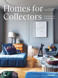 Interior living space with bronze figure on coffee table, framed portrait sketch on wall, on cover of 'Homes for Collectors', by Lannoo Publishers.