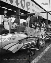 Book cover of Car Racing 1969, featuring racing driver sitting in jacked up car with no wheels. Published by Editions Cercle d'Art.