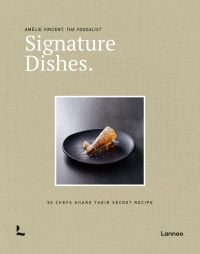 Black plate of parsnip crisp with apple-parsnip mousse and apple caramel, on beige cover of 'Signature Dishes. 50 Chefs Share Their Secret Recipe', by Lannoo Publishers.