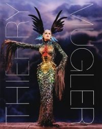 Thierry Mugler, La Chimère collection featuring sheath dress resembling a mythical beast with multicoloured scales, 'THIERRY MUGLER', in white font down left and right edges.