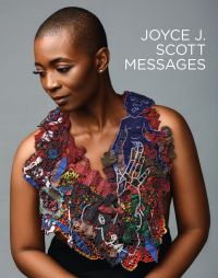 Black female modelling large, intricate beaded neck piece, on cover of 'Joyce J. Scott: Messages, by Arnoldsche Art Publishers.