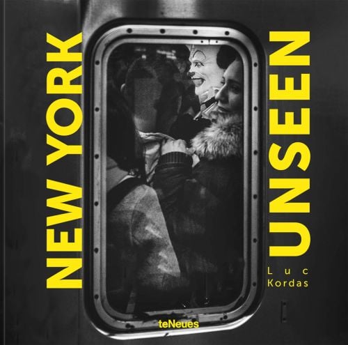 Window of packed commuter train, person wearing clown mask, on cover of 'NEW YORK UNSEEN', by teNeues Books.