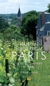 Vineyard with French commune behind, on travel guide cover of 'Half an Hour from Paris, 12 Secret Daytrips by Train', by Pallas Athene.