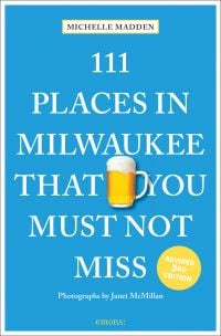 Glass tankard of beer near center of blue cover of '111 Places in Milwaukee That You Must Not Miss', by Emons Verlag.