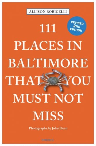 Blue crab near centre of orange cover of '111 Places in Baltimore That You Must Not Miss', by Emons Verlag.
