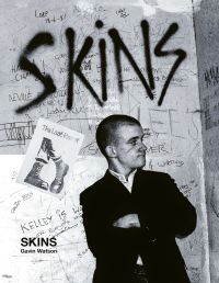 Book cover of Skins, featuring a young white male skinhead in black jacket, with his arms folded, looking to his left, and 'SKINS', in black graffiti on wall behind. Published ACC Art Books.