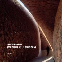 Interior wall and staircase of Jingdezhen Imperial Kiln Museum, visitor walking down corridor, by Images Publishing.