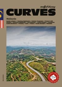 Aerial view of winding road through the mountainous Malaysian landscape, on cover of 'CURVES Malaysia', by Delius.