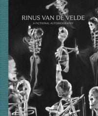 White skeletal figures on black cover, 'RINUS VAN DE VELDE, A FICTIONAL AUTOBIOGRAPHY', in silver font above. by Hannibal Books.