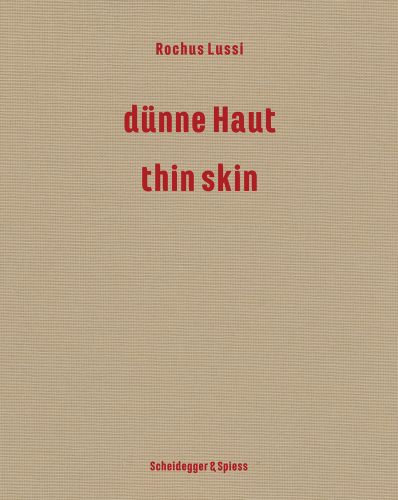 Beige cover of 'Rochus Lussi—Thin Skin, Works 1992–2023', by Scheidegger & Spiess.
