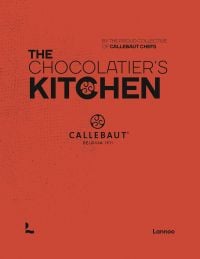 Orange cover of 'The Chocolatier’s Kitchen, recipe book', by Lannoo Publishers.