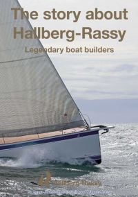 Bow of sailing boat on the sea, on cover of 'The Story About Hallberg-Rassy' by Delius Klasing Verlag GmbH.