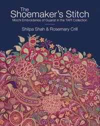 Book cover of The Shoemaker's Stitch: Mochi Embroideries of Gujarat in the TAPI Collection, with a floral embroidery in shades of red, green and purple. Published by Niyogi Books.