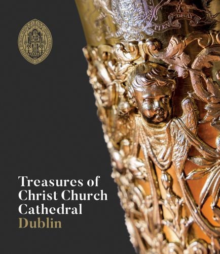 Intricate gold column with cherub, on cover of 'Treasures of Christ Church Cathedral Dublin', by Scala Arts & Heritage Publishers.
