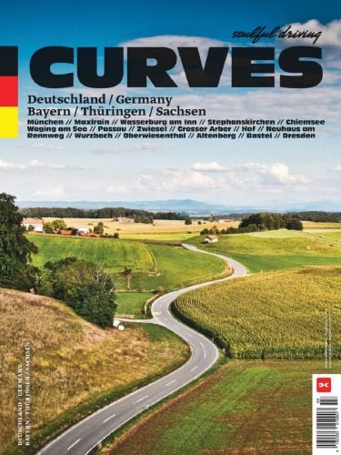 Winding road through fields in southeast Germany, on cover of 'CURVES Deutschlands Südosten / Germany's Southeast', by Delius.