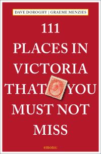 Red Canadian stamp bearing Queen Victoria's head, on red travel guide book '111 Places in Victoria That You Must Not Miss', by Emons Verlag.
