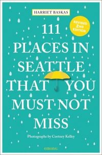 Falling raindrops, with yellow umbrella, on green cover of ' 111 Places in Seattle That You Must Not Miss', by Emons Verlag.