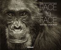 Close-up portrait of chimpanzee, on landscape cover of photobook 'Face to Face, With the Great Apes', by teNeues Books.