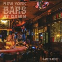Dark interior of 7B Horseshoe Bar aka Vazacs with juke box, on cover of Daniel Root's photobook, 'New York Bars at Dawn', by Abbeville Press.