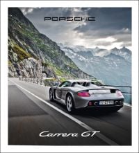 Book cover of Porsche Carrera GT, with a gray sportscar driving on roads around mountainous landscape. Published by Delius Klasing Verlag GmbH.